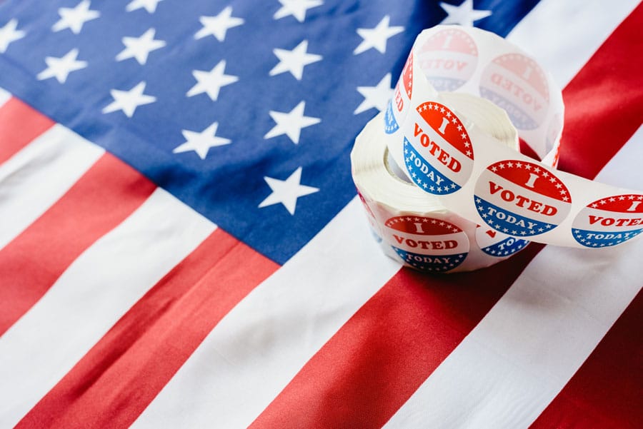 American flag with I voted stickers